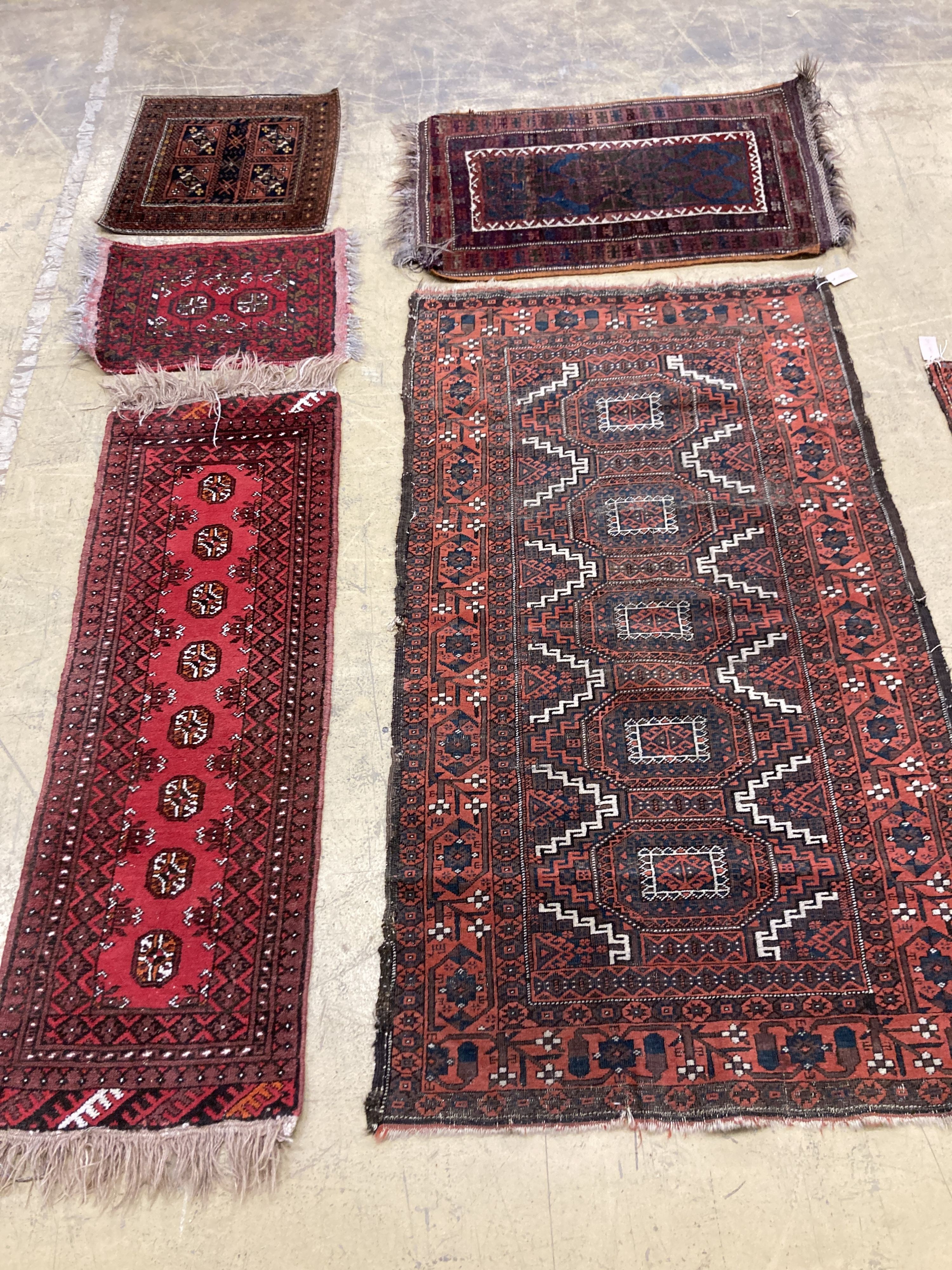 An antique Bokhara rug 170 x 94, Turkoman mat, a Belouch mat and two others.